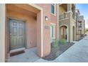 Inviting condo exterior with a private entrance, neutral tones, and well-maintained landscaping at 900 S 94Th St # 1204, Chandler, AZ 85224