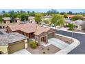 Stunning single-Gathering home boasts desert landscaping, a two-car garage, and a charming stone entrance at 9295 W Wood Dr, Peoria, AZ 85381