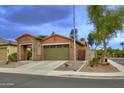 Charming single-Gathering home with desert landscaping and a two-car garage at 9295 W Wood Dr, Peoria, AZ 85381