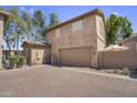 Two-story home with a two-car garage and low maintenance desert landscaping at 10132 E Isleta Ave, Mesa, AZ 85209