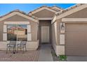 Charming single-story home featuring a covered entrance and desert landscaping at 1137 W 21St Ave, Apache Junction, AZ 85120