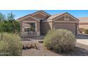 Inviting home featuring a cozy seating area and desert-friendly landscaping at 1137 W 21St Ave, Apache Junction, AZ 85120