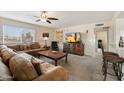 Cozy living room featuring comfortable seating, a ceiling fan, and a television at 17010 E Calle Del Oro -- # D, Fountain Hills, AZ 85268