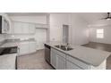 Kitchen with a large central island, stainless steel appliances, and granite countertops at 1739 E Elegante Dr, Casa Grande, AZ 85122