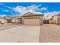 Charming single-story home featuring a two-car garage and low-maintenance desert landscaping at 1775 E Sycamore Rd, Casa Grande, AZ 85122