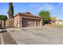 Spacious three-car garage with an extended driveway, providing ample parking and easy access at 2894 E Melody Ln, Gilbert, AZ 85234