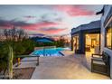 Inviting backyard pool with mountain views and a covered patio area, perfect for relaxing at 37646 N Dream St, Carefree, AZ 85377