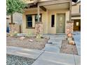 Charming single-story home featuring a covered porch and low maintenance desert landscaping at 3914 E Constance Way, Phoenix, AZ 85042