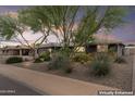 Inviting single-story home featuring desert landscaping, lush trees, and a peaceful neighborhood setting at 3931 W Augusta Ave, Phoenix, AZ 85051