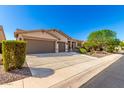 Charming single-story home showcasing a well-maintained front yard and an attached two-car garage at 41961 W Centennial Rd, Maricopa, AZ 85138