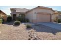 Beautiful single-story home featuring xeriscaping and a two-car garage at 45071 W Yucca Ln, Maricopa, AZ 85139