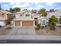 Stately two-story home featuring a three-car garage, well-manicured landscaping, and a tile roof at 5342 W Linda Ln, Chandler, AZ 85226