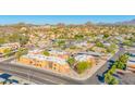 Aerial view of the apartment complex, showcasing the architecture and surrounding landscape with vibrant green trees at 604 E Weber Dr # 12, Tempe, AZ 85288
