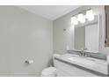 Bathroom featuring sleek white vanity and modern mirror with decorative lighting at 604 E Weber Dr # 12, Tempe, AZ 85288