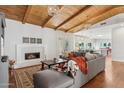 Inviting living room features vaulted ceilings, wood beams, fireplace, and lots of natural light at 8336 S Homestead Ln, Tempe, AZ 85284