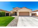 Attractive two-story home with well-maintained lawn and desert landscaping at 10043 W Foothill Dr, Peoria, AZ 85383