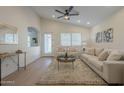 Bright living room with vaulted ceilings, light wood floors, and a neutral color palette at 1222 W Corriente Dr, San Tan Valley, AZ 85143