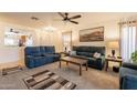 Comfortable living room featuring plush seating, neutral color scheme and ample lighting at 1374 E Linda Dr, Casa Grande, AZ 85122