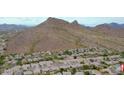 Scenic aerial view of a residential area nestled against a majestic mountain backdrop at 1614 E Kathleen Rd, Phoenix, AZ 85022