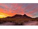 Stunning mountain view featuring a vibrant sunset and rugged desert landscape at 1614 E Kathleen Rd, Phoenix, AZ 85022