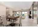 Open-concept living and dining area with modern furnishings and plenty of natural light at 1620 E Cloud Rd, Phoenix, AZ 85086