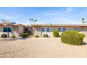 A charming single-story home featuring low-maintenance landscaping and an inviting facade at 16827 N 103Rd Ave, Sun City, AZ 85351