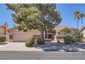 Charming single-story home featuring a two-car garage, stone accents, tile roof, and mature desert landscaping at 17246 N 56Th Way, Scottsdale, AZ 85254