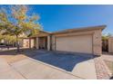 Charming single-story home with a welcoming front porch and a two-car garage at 2573 S Powell Rd, Apache Junction, AZ 85119