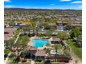 Community aerial view featuring a resort-style pool, lush landscaping, and cozy lounging areas at 29031 N 125Th Ln, Peoria, AZ 85383