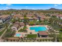 Aerial view showcasing the community pool and hot tub in a desert neighborhood at 29031 N 125Th Ln, Peoria, AZ 85383
