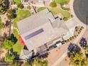 Aerial view of the property featuring a rooftop solar panel and backyard patio at 4638 S San Benito Ct, Gilbert, AZ 85297
