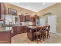 Kitchen with tile floor, stainless steel appliances, and granite counters at 4638 S San Benito Ct, Gilbert, AZ 85297