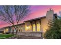 Exterior showcasing the stone accents, well-maintained landscaping, and stylish architectural details at 6328 W Fetlock Trl, Phoenix, AZ 85083