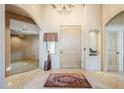 Grand foyer with tile flooring, chandelier, and views into the living spaces at 6545 E Ponderosa Loop, Gold Canyon, AZ 85118