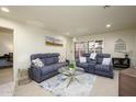 Inviting living room with plush seating, stylish decor, and abundant natural light at 12212 N Paradise Village S Pkwy # 136, Phoenix, AZ 85032