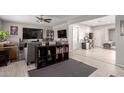 Open-concept living room featuring tile floors and neutral paint at 1310 W Romo Jones St, Tempe, AZ 85281