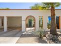 Charming single-story home with a carport, brick-trim archway and desert landscape for a unique style at 1401 E Griswold Rd, Phoenix, AZ 85020