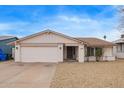 Charming single-story home featuring a low maintenance front yard and a two-car garage at 1627 E Saint Anne Ave, Phoenix, AZ 85042