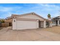 Charming single-story home featuring a low maintenance front yard, a two-car garage, and desert landscaping at 1627 E Saint Anne Ave, Phoenix, AZ 85042