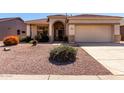 Lovely single-story home with desert landscaping, tile roofing, and a spacious driveway at 17805 W Arizona Dr, Surprise, AZ 85374