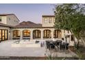 Beautiful outdoor patio with stone tile, mountain views, and an outdoor dining area at 19978 N 101St Pl, Scottsdale, AZ 85255