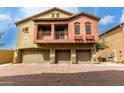 Two-story condo with a three-car garage and a brick driveway at 2150 E Bell Rd # 1176, Phoenix, AZ 85022