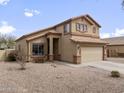 Attractive two-story home boasts a neutral color palette and low-maintenance desert landscaping at 22336 E Via Del Palo --, Queen Creek, AZ 85142