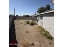 The backyard features a blank canvas for your outdoor dreams, and a covered patio at 2801 W Camelback Rd, Phoenix, AZ 85017