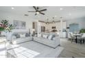 Bright living room featuring neutral décor, stylish ceiling fan, and lots of natural light at 4077 S Sabrina Dr # 138, Chandler, AZ 85248