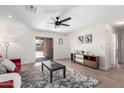 Spacious living room with sliding glass doors to outdoor space and sleek modern decor at 43795 W Sagebrush Trl, Maricopa, AZ 85138