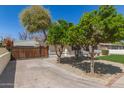 Charming home featuring mature citrus trees, lush lawn, and a quaint curb appeal at 458 N Drew W St # West, Mesa, AZ 85201