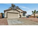 Inviting one-story house with well-kept yard, two-car garage, and concrete driveway at 4804 W Topeka Dr, Glendale, AZ 85308