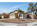 Attractive single-level home with desert landscaping, tile roof and a two-car garage at 4804 W Topeka Dr, Glendale, AZ 85308