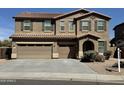 Two-story home boasts a three-car garage, tiled roof, and neutral-toned stucco at 6755 S Tucana Ln, Gilbert, AZ 85298